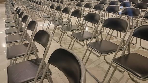 istock rows of empty chairs in a meeting hall. 2183779138