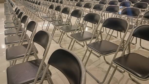 istock rows of empty chairs in meeting room. 2183779142