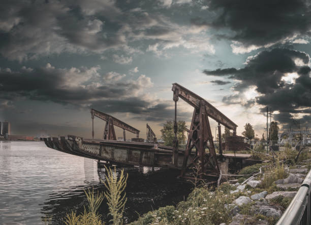 An abandoned vintage commercial dock and pier along the shore of the Detroit River in Windsor, Ontario.