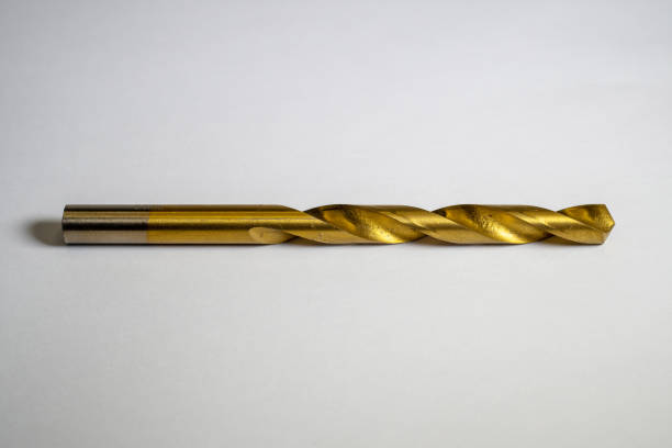 istock Iron drill bit made of brass with isolated focus concept on white background 2183782915
