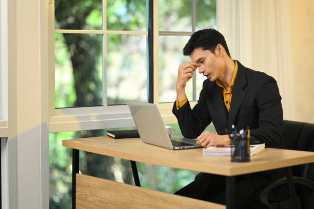 istock Frustrated businessman experiencing mental fatigue during office work 2183790273