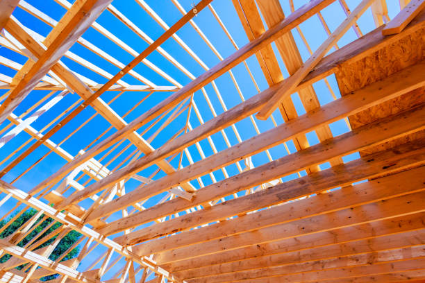 istock Open roof structure with a large framework skeletal frame constructed from wood beams 2183791511