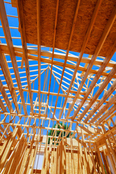 istock Wooden structure framework skeletal frame of a building, highlighting intricate network of wooden beams 2183791514