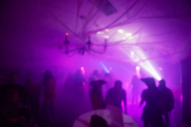 istock Blurred Costume Party At Night with People Dancing 2183792417