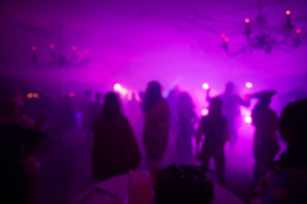 istock Blurred Costume Party At Night with People Dancing 2183792421