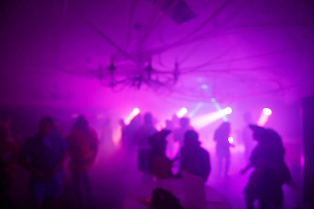 istock Blurred Costume Party At Night with People Dancing 2183792427