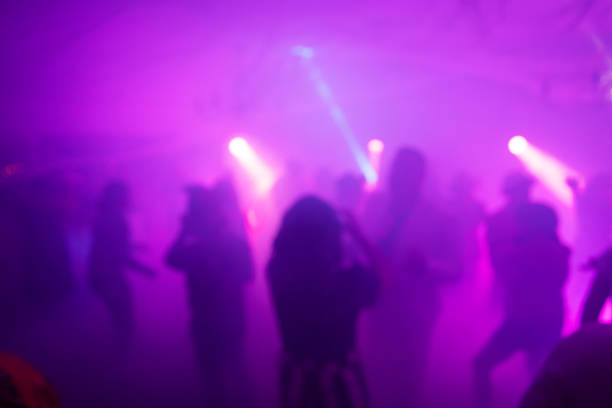 istock Blurred Costume Party At Night with People Dancing 2183792437