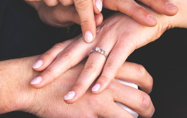 istock Man and woman holding hands ring engagement close up 2183794901