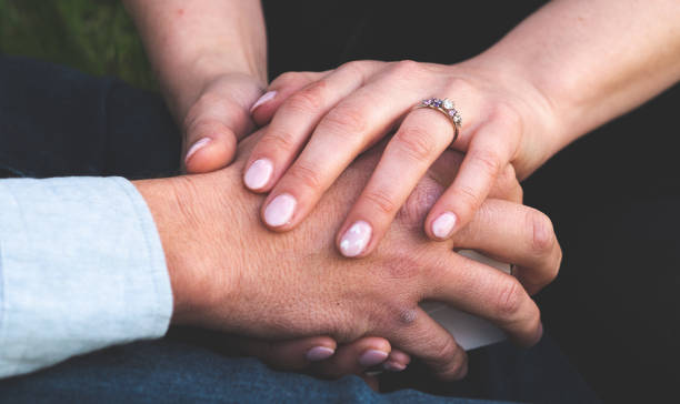istock Man and woman holding hands ring engagement close up 2183795914