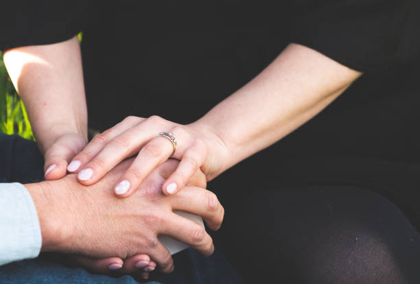 istock Man and woman holding hands ring engagement close up 2183796151