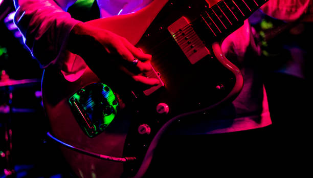 istock Live music performance musician playing guitar close up hands 2183796777