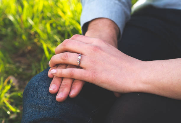 istock Man and woman holding hands ring engagement close up 2183797383