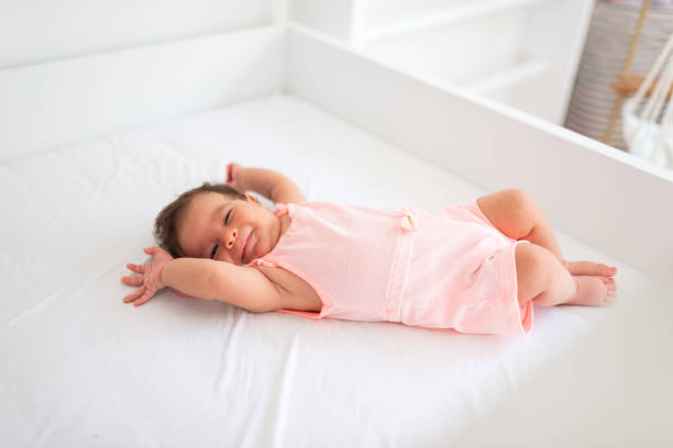 istock Smiling newborn baby girl 2183799457
