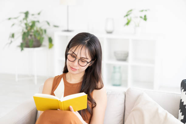 istock attractive asian woman who reads a book, 2183800182