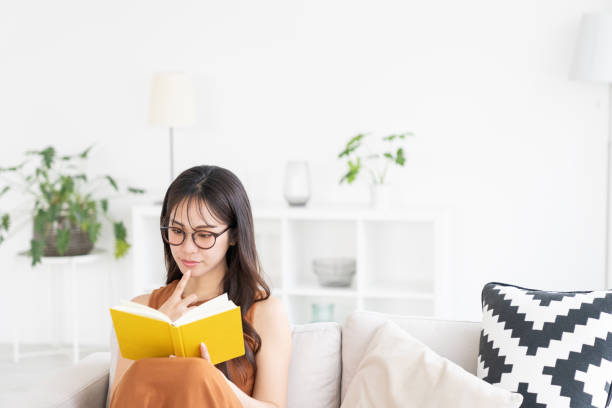 istock attractive asian woman who reads a book, 2183800224