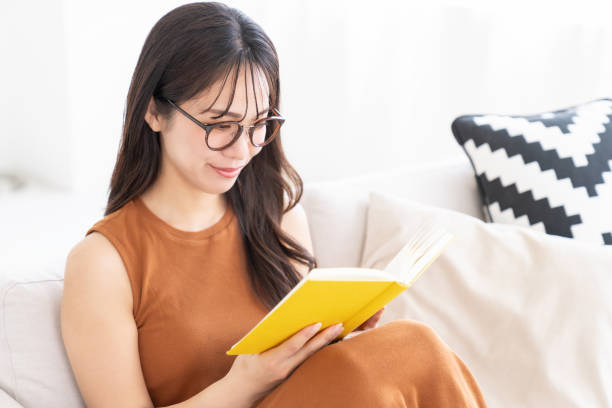 istock attractive asian woman who reads a book, 2183800291