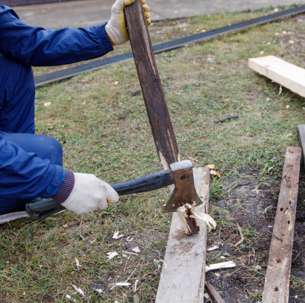 istock A man is using an axe to split a piece of wood 2183807509