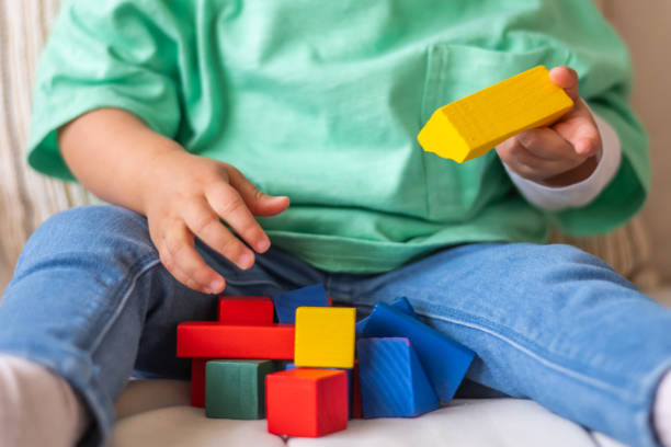 istock Curious Toddler Playing With Learning Toys And Building Blocks, Developing Cognitive Skills And Creativity 2183808781