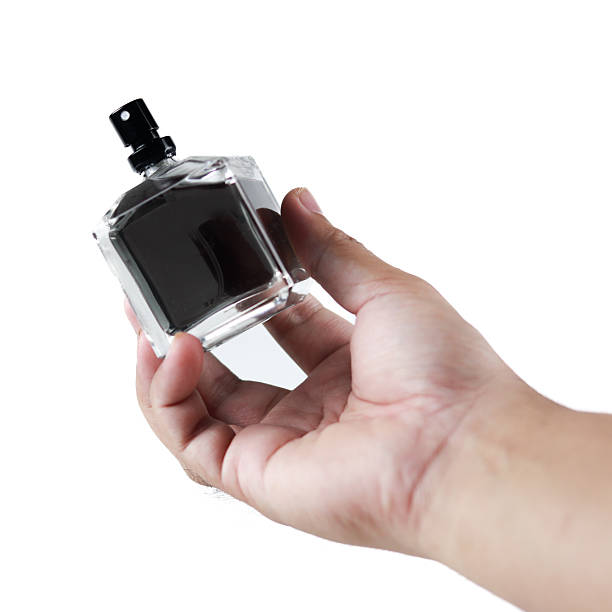istock Man's hand holding bottle isolated on white background, clipping path 2183809008