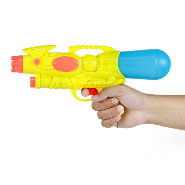 istock Hand holding plastic water gun isolated on white background 2183809167