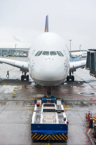 Frankfurt, Germany-September, 2019: Pushback tug taxis out a large aircraft