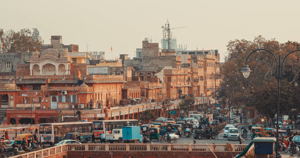 Jaipur, Rajasthan, India. Traffic On Chanpole Bazar Rd. Chhoti Chopad Street During Morning. Cars Moving On Street. Tuk-tuk Cycle, Bikes, Cars, Motorcycles Moving On Street. Early Morning In India. Every Day Life Of India. Busy Traffic In City Street. jaipur, rajasthan, india. traffic on chanpole bazar rd. chhoti chopad street during morning. cars moving on street. tuk-tuk cycle, bikes, cars, motorcycles moving on street. early morning in india. every day life of india. busy traffic in city street