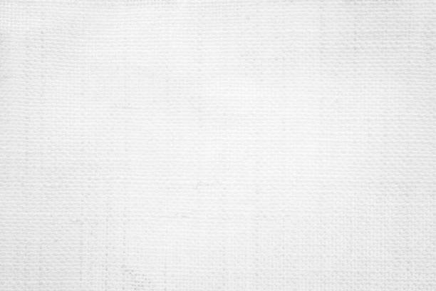 istock White color fabric canvas woven texture background in pattern light blank. Natural gauze linen, carpet wool and cotton cloth textile textured as clean empty for decoration text. Grey sack material. 2183815645