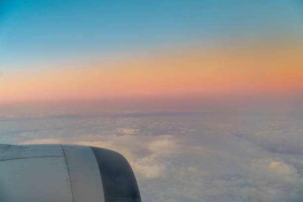 Looking from the window of plane at sunset