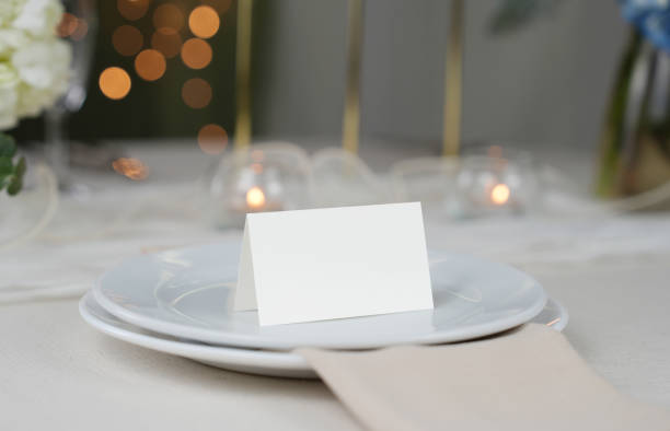 istock Mockup white blank space card, for Name place, Folded, greeting, invitation on wedding table setting background. 2183819865