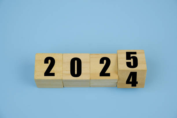 istock Cubes with numbers 2024 and 2025 on blue background. 2183820282