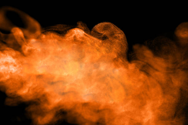 istock Orange Powder Smoke Black Background 2183820315