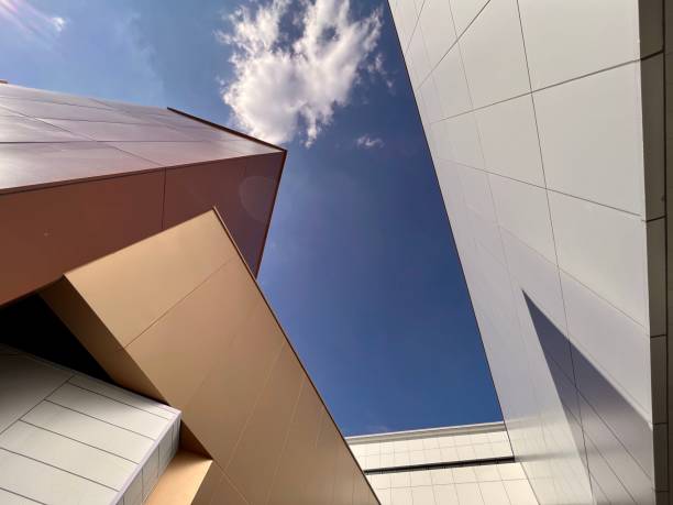 istock Modern Architectural Abstract with Geometric Facades Against Blue Sky. 2183822689
