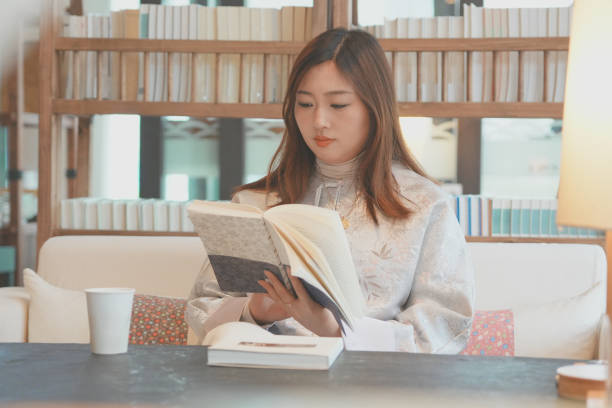 istock Women reading a book with afternoon tea 2183828111