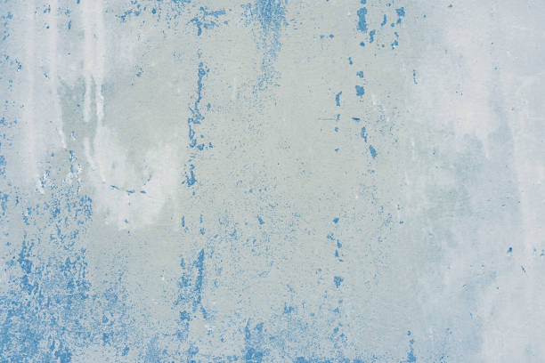 istock Textured blue plaster wall surface with peeling paint. Aged, weathered concrete background 2183830979