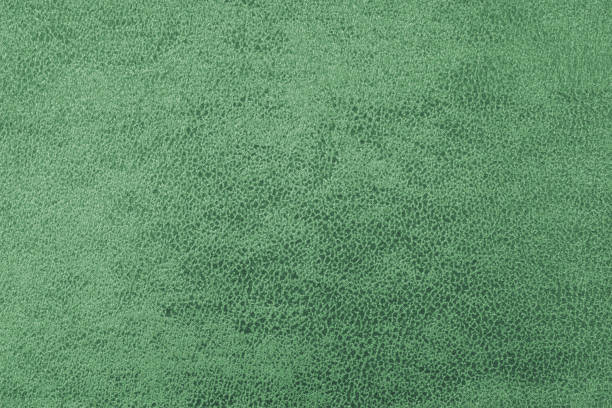 istock Cloth structure of jacquard green fabric with abstract shabby texture background closeup, macro 2183831003