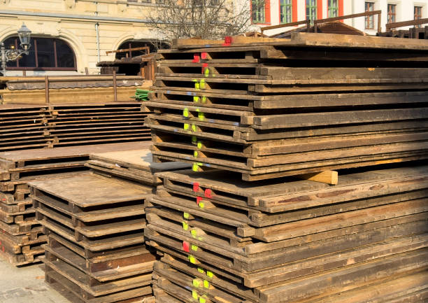stacks of wooden pallets on a construction site