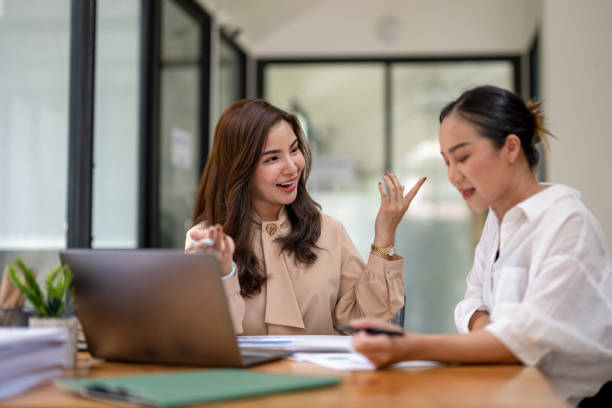 istock Two business women sit and discuss plans for a new project. Brainstorm and share ideas. 2183836107
