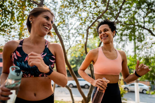 istock Friends talking while running at the park 2183838071