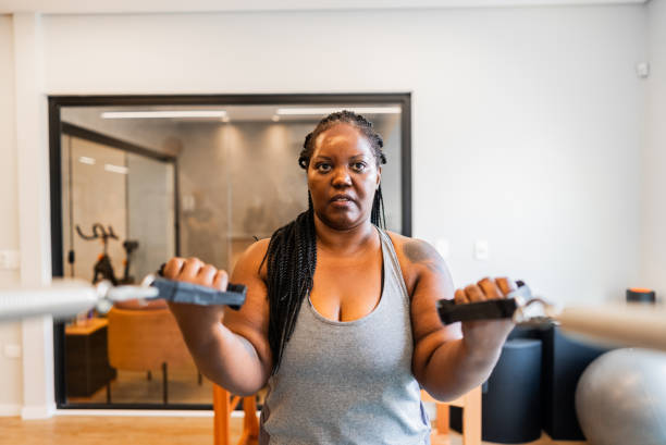 istock Mature woman exercising at a pilates studio 2183839076