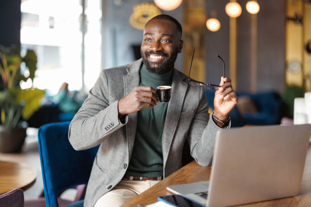 istock Man removing glasses while enjoying espresso in cafe 2183841513