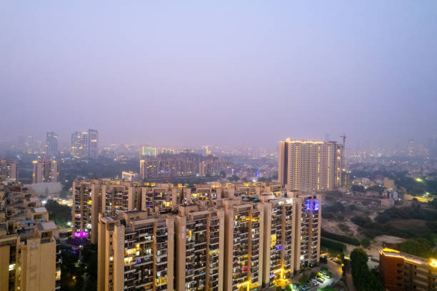 istock aerial drone shot looking down over skyscrapers multi storey with park in between with lights for the hindu festival of diwali, new year showing the scale of celebration and cityscape in Gurgaon Delhi 2183842518
