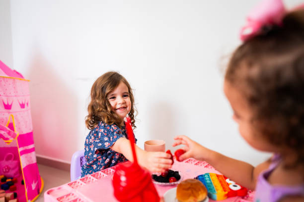 istock Sisters eating fruits at home 2183843868