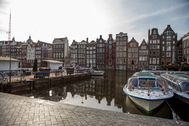 istock Amsterdam houses along the canal 2183845719