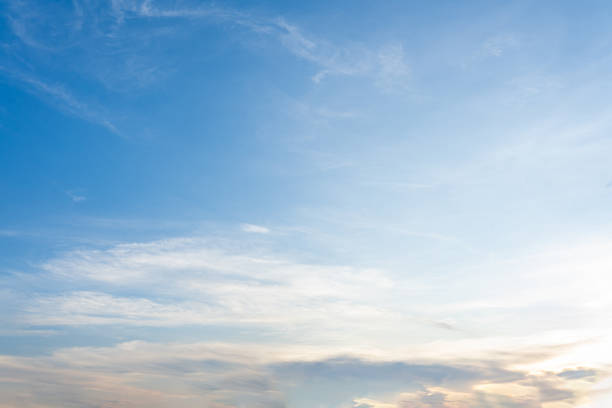 istock Beautiful cloudscape with fluffy white clouds against a clear blue sky 2183850318