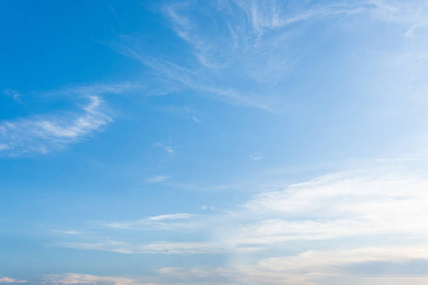 istock Beautiful cloudscape with fluffy white clouds against a clear blue sky 2183850320