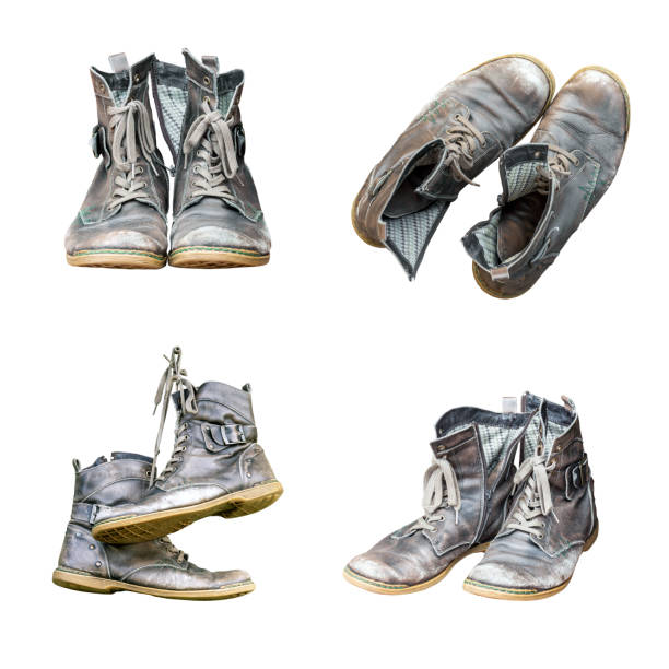 Black leather hiking boots on a black rubber mat