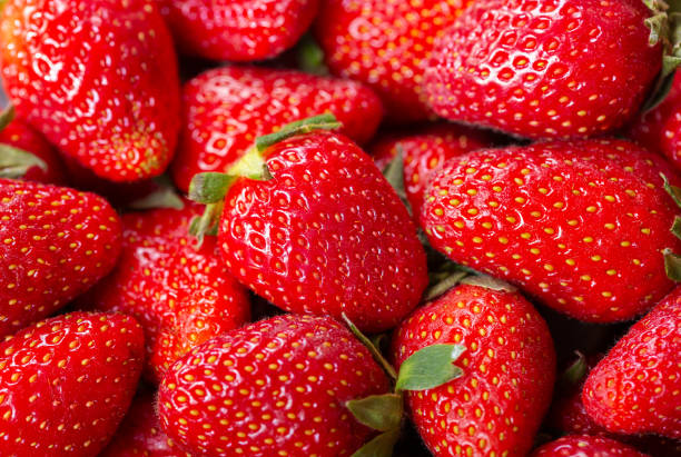 fresh strawberries as background, top view