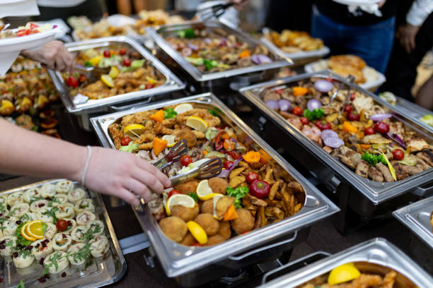 istock A vibrant buffet spread featuring an array of colorful dishes at a lively event with guests serving themselves 2183854647