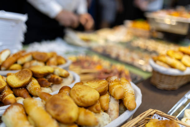 istock Assorted freshly baked bread rolls and pastries displayed at a lively local market during the afternoon 2183854772