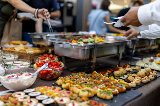 istock A delightful buffet spread with an array of colorful dishes and desserts at a bustling event in the afternoon 2183855422